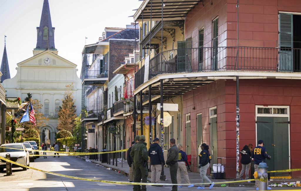 The FBI investigates the area on Orleans St and Bourbon Street by St. Louis Cathedral in the French Quarter where a suspicious package was detonated after a person drove a truck into a crowd earlier on Bourbon Street on Wednesday, Jan. 1, 2025. (AP Photo/Matthew Hinton)